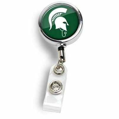 Silver badge reel with a clear folded clip. The face of the reel is dark green with a white Sparty MD logo (spartan helmet wearing a stethoscope)