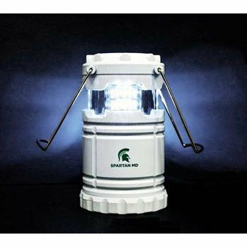 White pop-up camping lantern with a green Spartan helmet printed above text reading Spartan MD