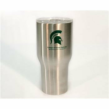Silver tumbler with a narrow bottom for cupholders and a clear lid. On the top half of the tumbler, a dark green Spartan helmet is printed above text reading College of Huma Medicine, Michigan State University