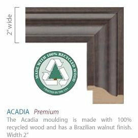 Close-up render of the 2" wide frame corner. Text reads "The Acadia moulding is made with 100% recycled wood and has a Brazilian walnut finish." Frame has a classic molding style groove
