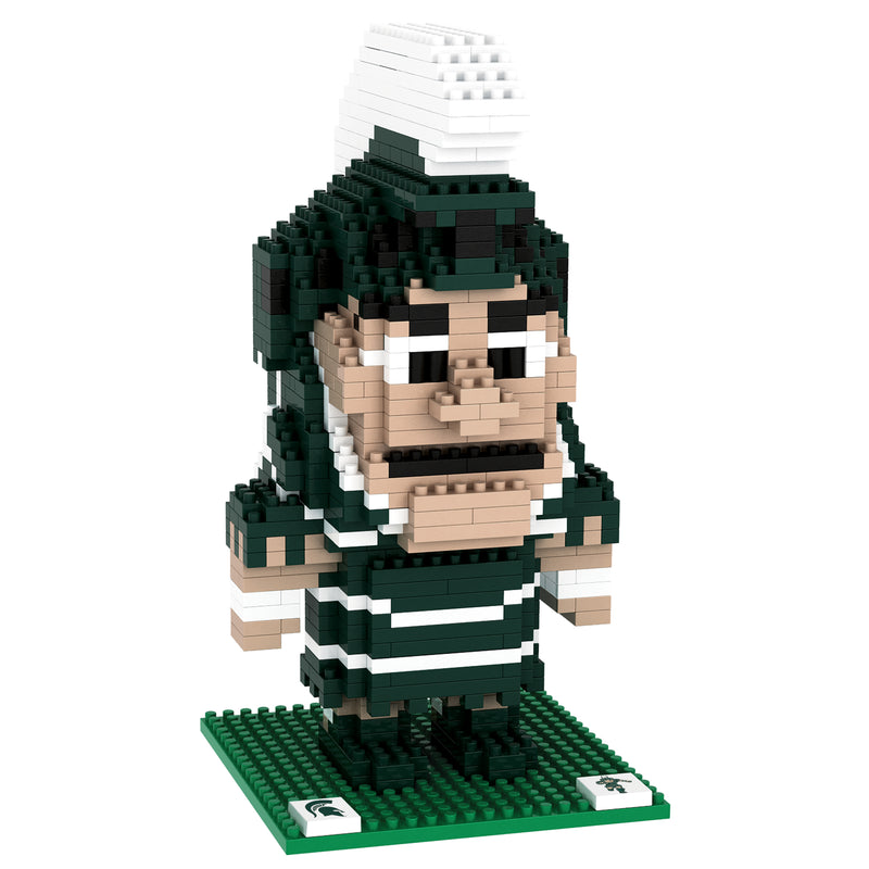 Three-quarters view of the assembled Sparty BRXLZ mascot, facing slightly right. Like the real Sparty, the BRXLZ mascot is wearing a green outfit and helmet with white accents.