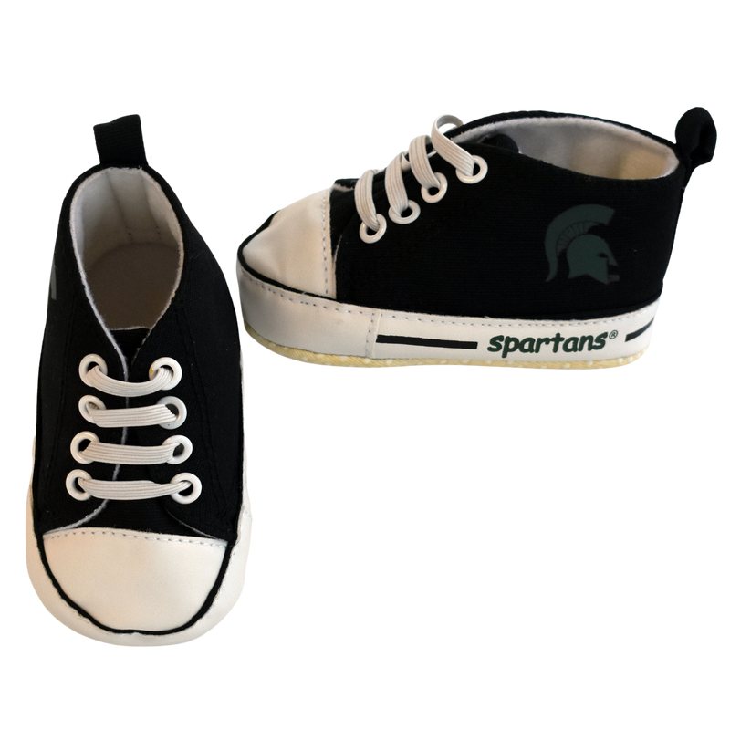 Baby shoes styled after black high-top shoes with faux laces. On the outside of each shoe is a green Spartan helmet print, with green font reading Spartans next to a black stripe on the sole