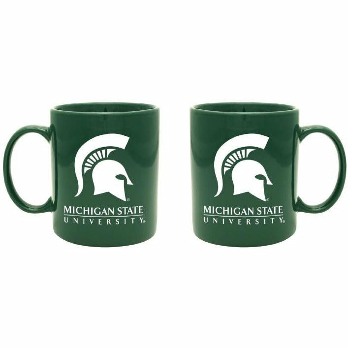 Forest green ceramic mug with a large white Spartan helmet above the university wordmark printed on each side of the mug.