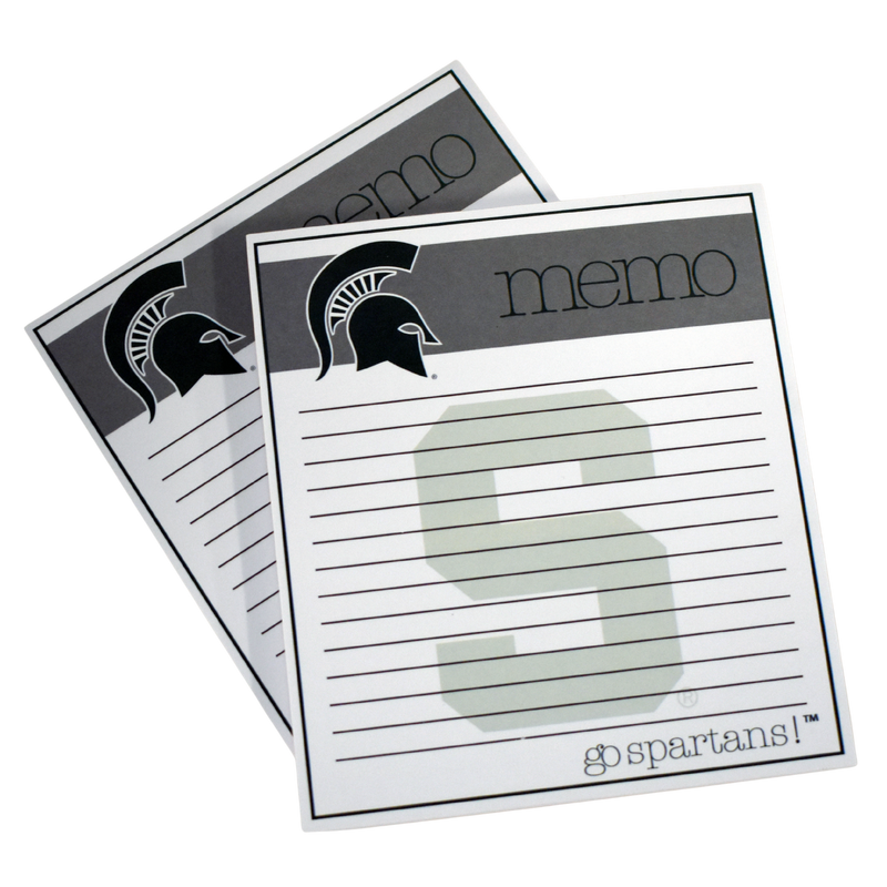 Square notepad with a tan block along the top reading "memo" with a dark Spartan helmet on the left. In the center of the pad are 14 lines, with a watermark block S. At the bottom, thin font reads "go Spartans!"