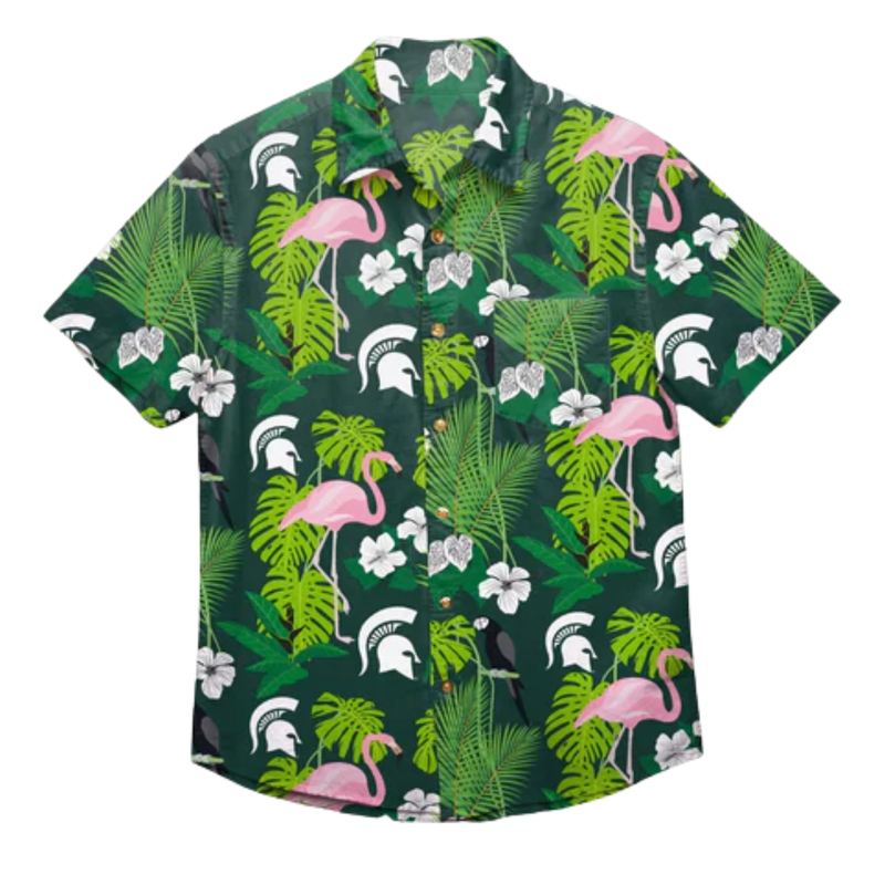 Flat view of the Michigan State Spartans Floral Button-Up, which is dark green. The shirt is patterned with pink flamingos, white hibiscus flowers, white Spartan helmets, and a variety of green leaves.
