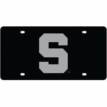 Black license plate with four screw slots. A chrome block S is centered on the plate.