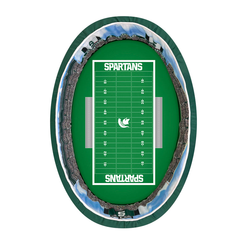 Overhead view of dog bed printed with a green football field with white yardlines, Spartans in the end zone, and a Spartan helmet at midfield