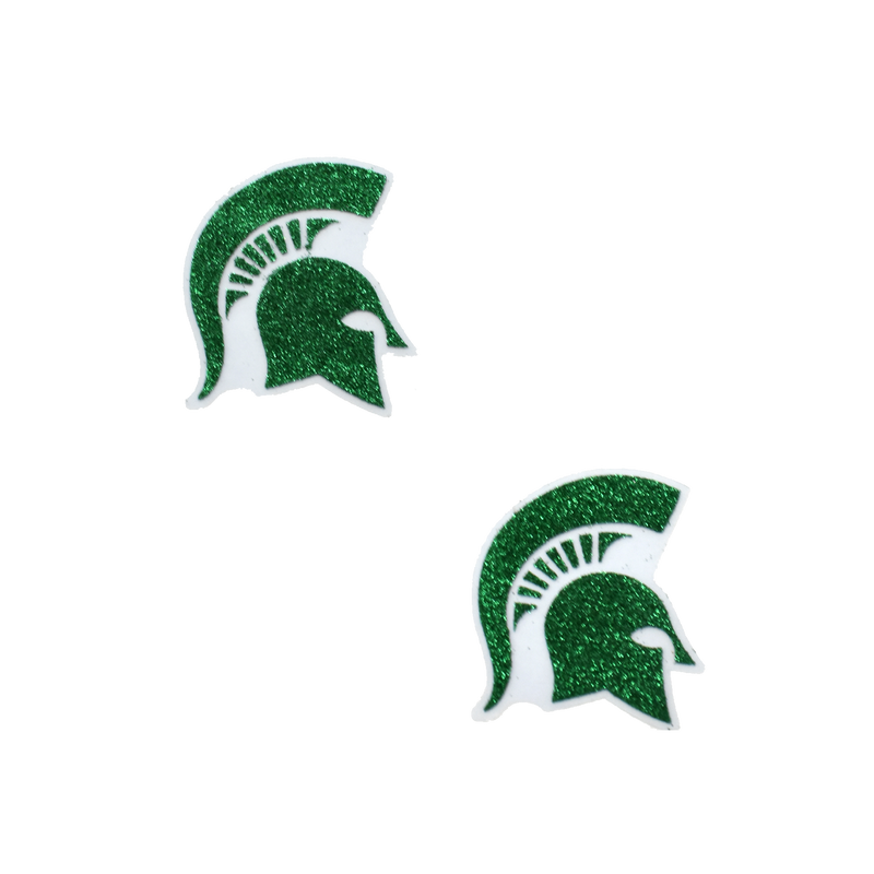 Two green glitter stickers in the shape of Spartan helmets, each with a slight outline that appears clear when on skin