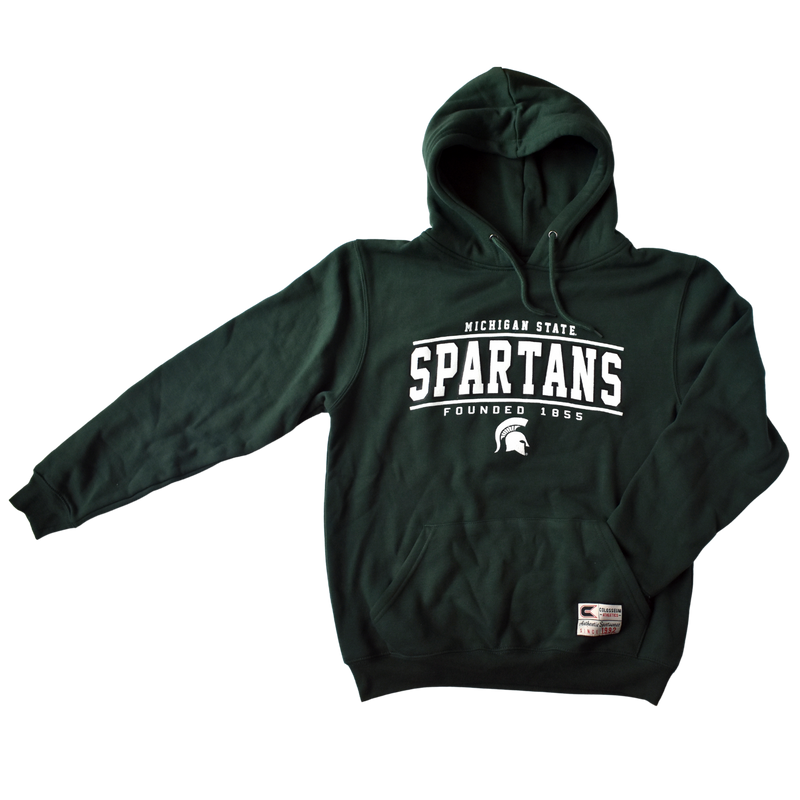 Forest green hooded sweatshirt with matching shoelace-style drawstrings and a kangaroo pocket. Printed in white on the center chest are three slightly curved lines of text over a small white Spartan helmet. The top line reads Michigan State, second line is Spartans, and bottom line is Founded 1855.