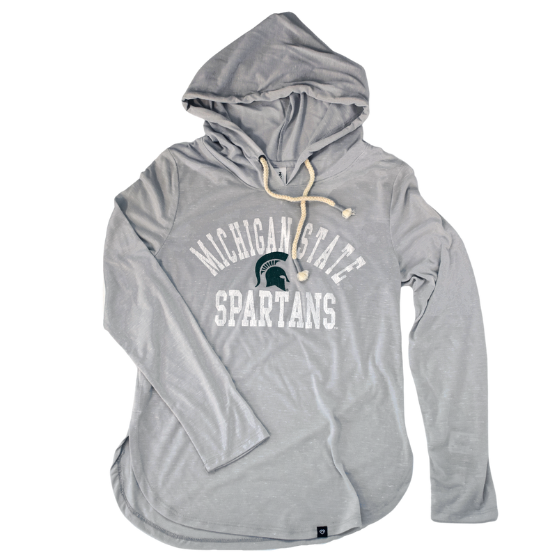 Light heather gray t-shirt hoodie with a rounded hem. The hood's drawstrings are cream-color rope. Printed on the center chest is a green Spartan helmet with arched white text above reading Michigan State in block letters. Below the helmet is white block letters in a straight line reading Spartans.