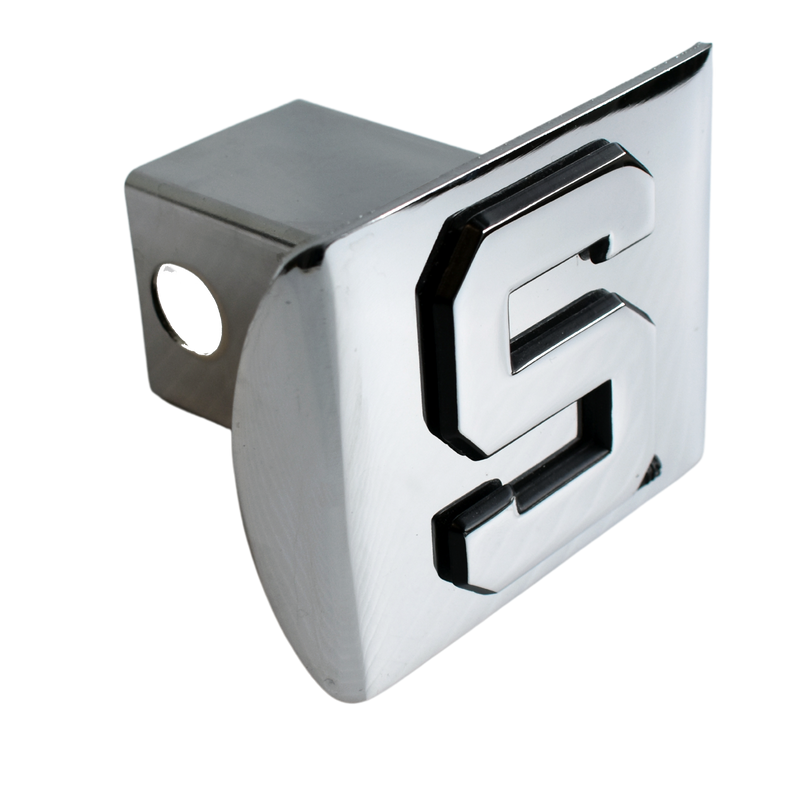 A 3D chrome Spartan block S is affixed to a chrome tow hitch cover, shown at a three-quarters angle