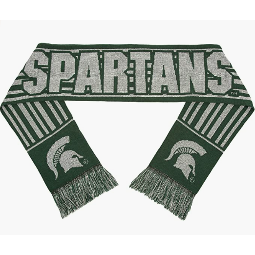 Dark green scarf with silvery gold details in vertical stripes, block text reading Spartans, and two Spartan helmets (one on each scarf end). The short ends of the scarfs are lined with a green and gold fringe.