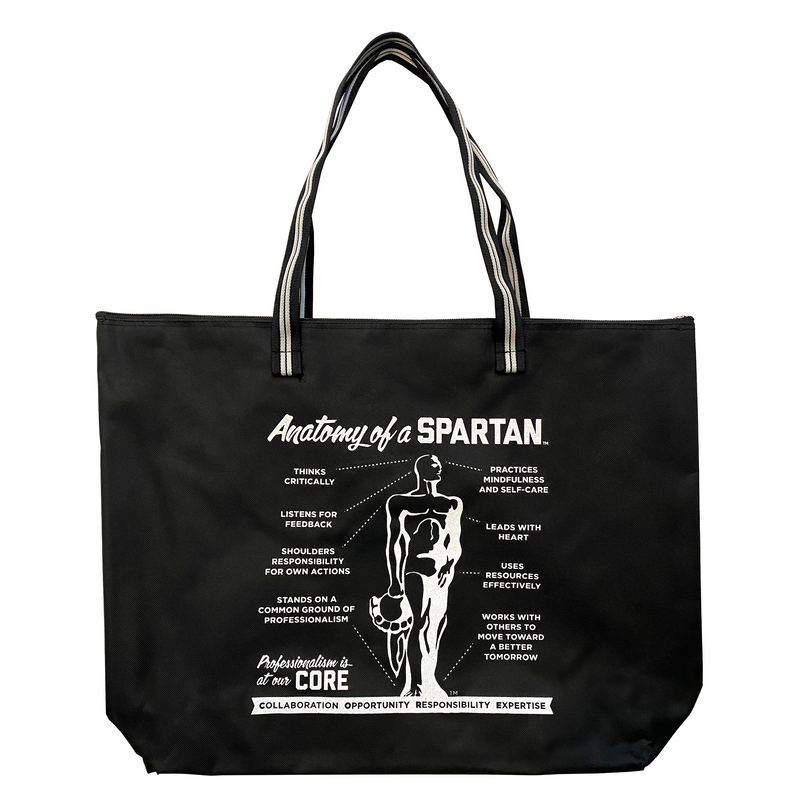Black zippered tote bag with a black and white striped handle. Graphic in white reads Anatomoy of a Spartan and a variety of descriptive qualtities, including thinking critically and leads with heart.