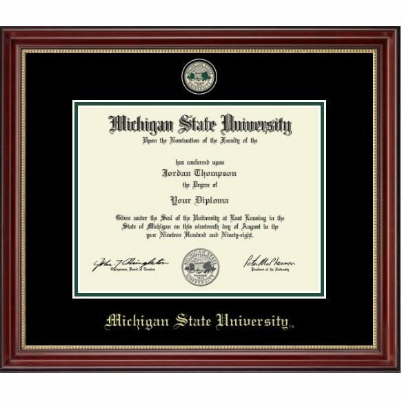 MSU diploma inside a thin strip of green and white mat. Top black mat is embossed with the university seal at the top and old English style font reading "Michigan State University" at the bottom, both in gold. Frame is a dark red wood with gold beading on the inside. wood 